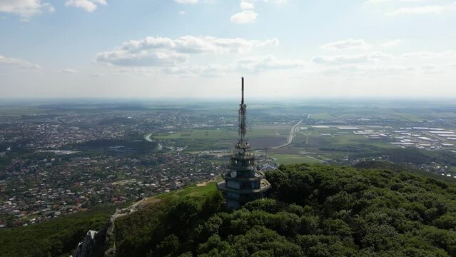 Drone is circling around Pyramid Radio tower on top of Zobor Mountain, 4k
