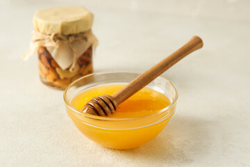 Concept of tasty and sweet food - honey with nuts
