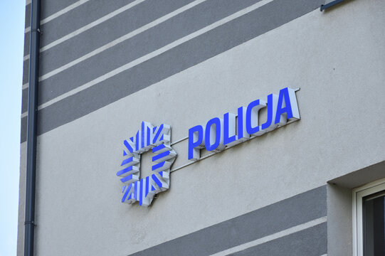 Policja (Police) logo, signage, emblem on the facade of Police station of Warszawa Wilanow district. WARSAW, POLAND - JUNE 6, 2021