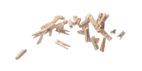 Wooden clothespins float gracefully in air, purposeful clips and holds transformed into a dance of household order and creative inspiration. Beige bundle of laundry dangles. White background isolated