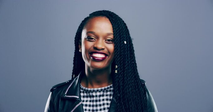 Happy, face and black woman with thumbs up in a studio for agreement, success or achievement. Happiness, excited and portrait of female model with approval hand gesture isolated by gray background