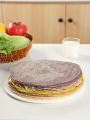 Colorful burritos made of flour with vegetables and meat, healthy breakfast, Chinese food