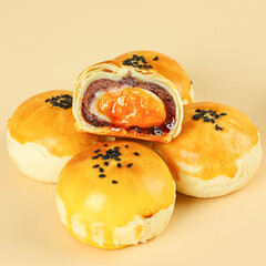 Egg-Yolk Puff, made from wheat and duck eggs and butter, traditional Chinese pastry, mooncakes filled with egg yolk