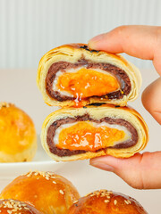 Egg-Yolk Puff, made from wheat and duck eggs and butter, traditional Chinese pastry, mooncakes filled with egg yolk