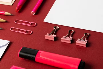  Flat lay of white papers with copy space and school materials on red background © vectorfusionart