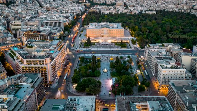 Aerial time lapse view of the Syntagma Square in Athens, Greece, during dusk, with car traffic