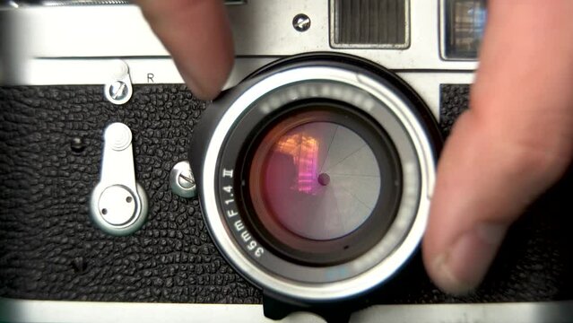 Setting the Aperture on Leica M2 Vintage Camera Lens, Film Photography Footage, 4K close up shot
