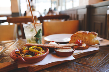 A selection of best appetizers of Portugal food or portuguese tapas - smoked ham, peppers, a...