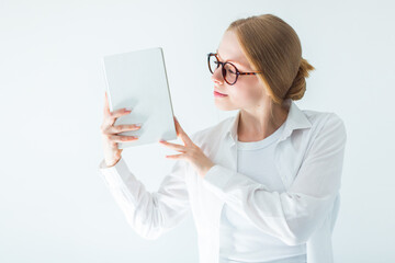 Serious student woman in eye glasses with a book. Happy smart girl, education concept