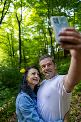 Couple outside in the park taking a selfie