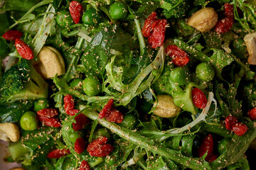 Green salad with goji berries and broccoli in a plate