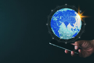 Technology for Global Business,World wild Technology concept.,Businessman using smartphone with World and connection line icon over black background use for communication idea.