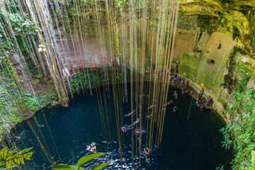 Ik-Kil Cenote, Beautiful cenote with clear clear water and hanging roots in January. Chichen Itza, Yucatan, Mexico