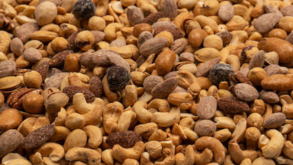 A group of almonds, pistachios, walnuts, macadamia, cashews.