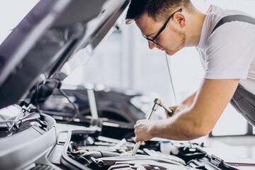 Repair man making car service