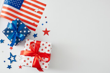 Obraz premium Gift theme concept for American Independence Day. Top view flat lay of gift boxes, national flag, confetti in the form of stars on white background with blank space for message or promo