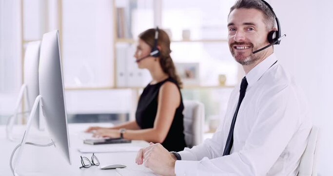 Call center, man and face at computer for customer service, technical support and CRM consulting. Portrait, happy agent and salesman at desktop for telemarketing, online help or contact us for advice