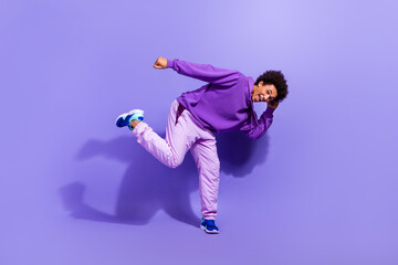 Full size photo of funny funky satisfied positive person wear violet hoodie pants dancing having...