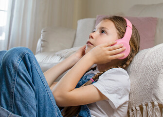 Cute girl with headphones listening to music