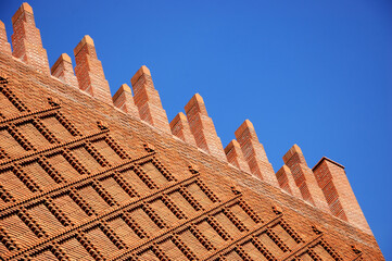 Abstract architectural detail of red brick wall and rood. Michelet Center Art and Archeology...