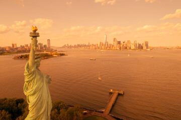 Statue of Lioberty NYC covered in orange haze from 2023 Canada fires
