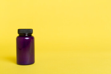 Plastic bottle for vitamins on color background