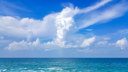 White fluffy clouds with blue sky and little island landscape background