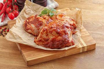 Marinated chicken leg in tomato sauce