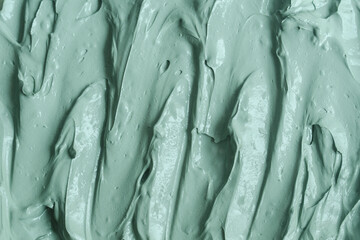 Green bentonite facial clay (alginate mask, face cream, body wrap) texture close up, selective...