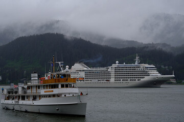 Luxury Silver cruiseship cruise ship liner Muse arrival into port of Juneau, Alaska during nature...