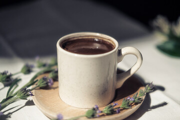 ottoman style turskish coffee in organic porcelain and wooden cup, lavender flowers