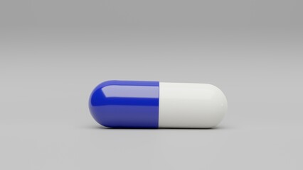 One dark blue white capsule pill on a white background - Medicine healthcare medicaments