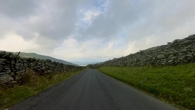 4k video driving along a narrow lane in a rural area of the Lake District, Cumbria, UK