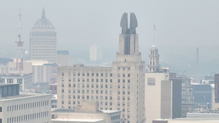 Poor air quality in Rochester NY caused by Canadian wildfire smoke over the city skyline dense...