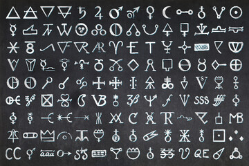 Hundreds of glyphs used in Alchemy drawn on a Blackboard