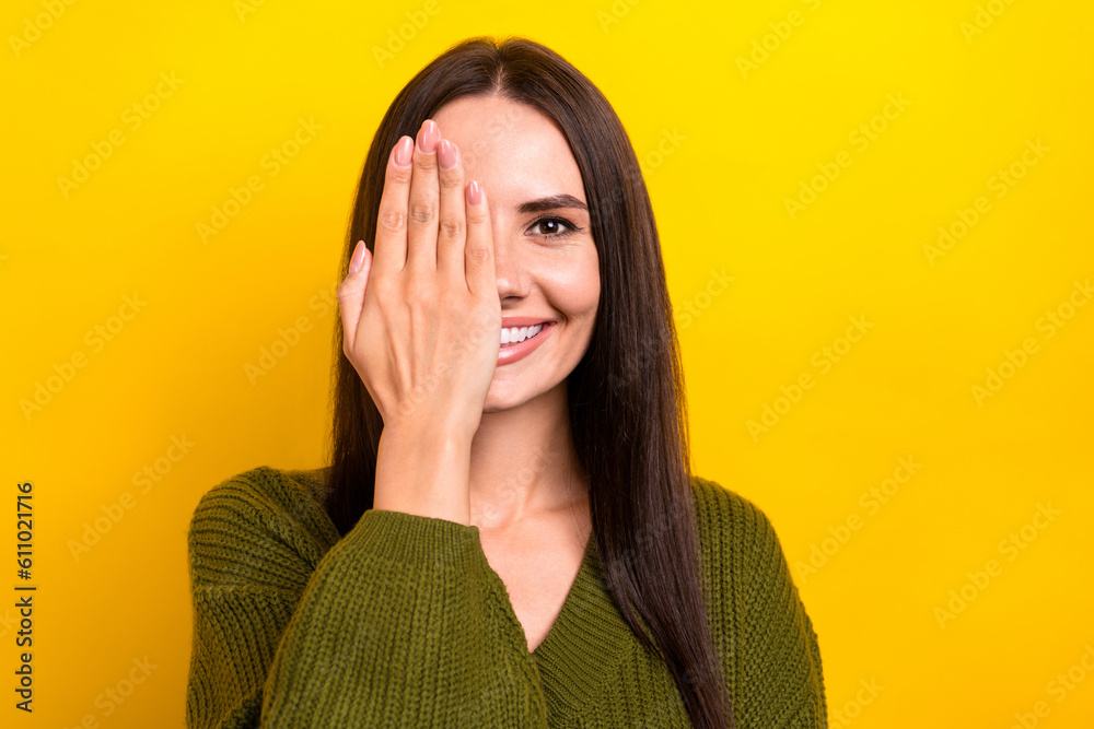 Sticker Photo of nice cheerful lady arm palm cover one eye beaming smile isolated on yellow color background