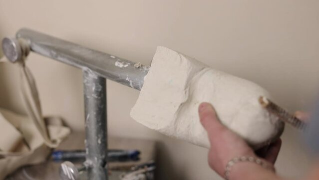 Prosthetic leg, Mold development, Design optimization. Gentleman producing mold for hip disarticulation prosthetic leg, eliminating needless aspects for efficiency.