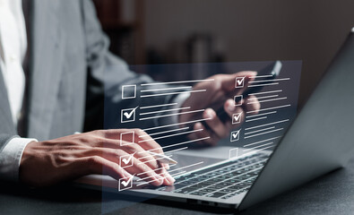 Checklist concept, businessman checking mark on checklist.  online survey form completion Corporate.