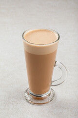 Glass mug of hot latte coffee macchiato - obrazy, fototapety, plakaty