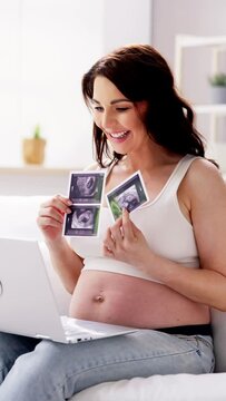 Pregnant Woman With Laptop Computer