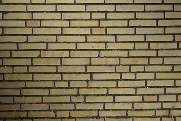 Brick wall with different shades of yellow 