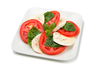 Traditional caprese salad on a square salad bowl isolated on white background. - 611030192