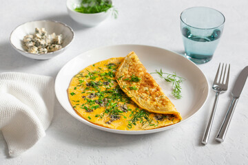 omelette with blue cheese herbs spring onion. healthy keto diet low carb breakfast