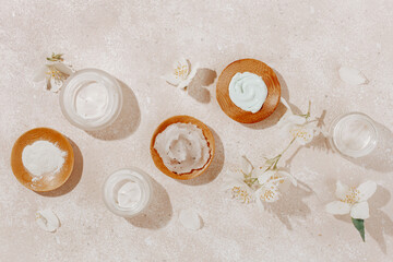 skincare products and jasmine flowers. natural cosmetics for home spa treatment