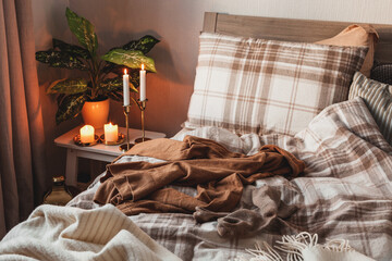 cozy scandinavian bedroom interior in natural tones, real life mess disorder