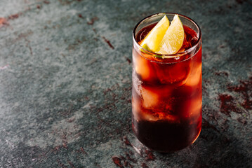 Fresh made coktail Cuba Libre with brown rum, cola and lemon 