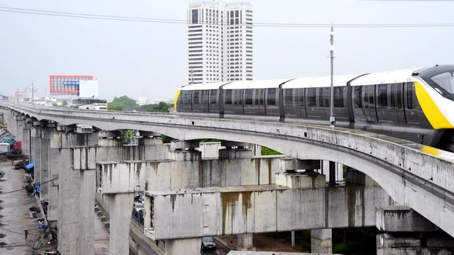 Bangkok,Thailand - 6June, 2023: Thai electric monorail train yellow line in Bangkok