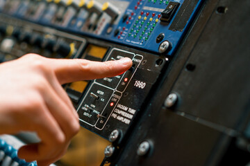 Sound Engineer Using Digital Audio Mixer Sliders Engineer Pressing Power Button Control Panel...