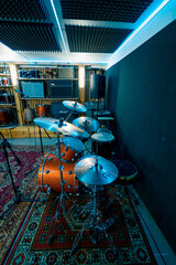 empty professional recording studio with musical instruments drums speakers rack with microphone neon light