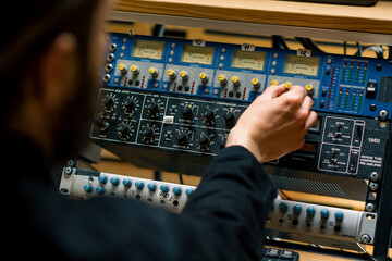 Sound engineer used digital audio mixer Sliders Engineer presses key Control panel Recording studio...